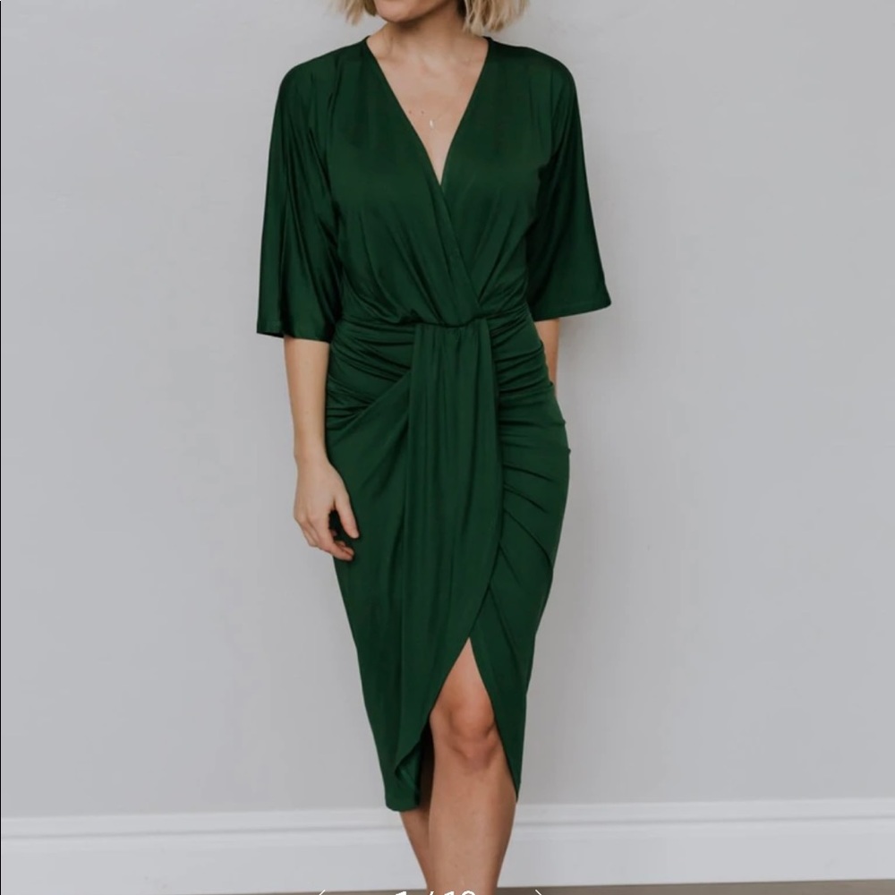 Emerald green midi dress. Size Large. High-low hem. V-neckline. Bodycon fit.